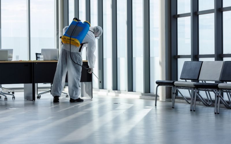man-doing-disinfection-office